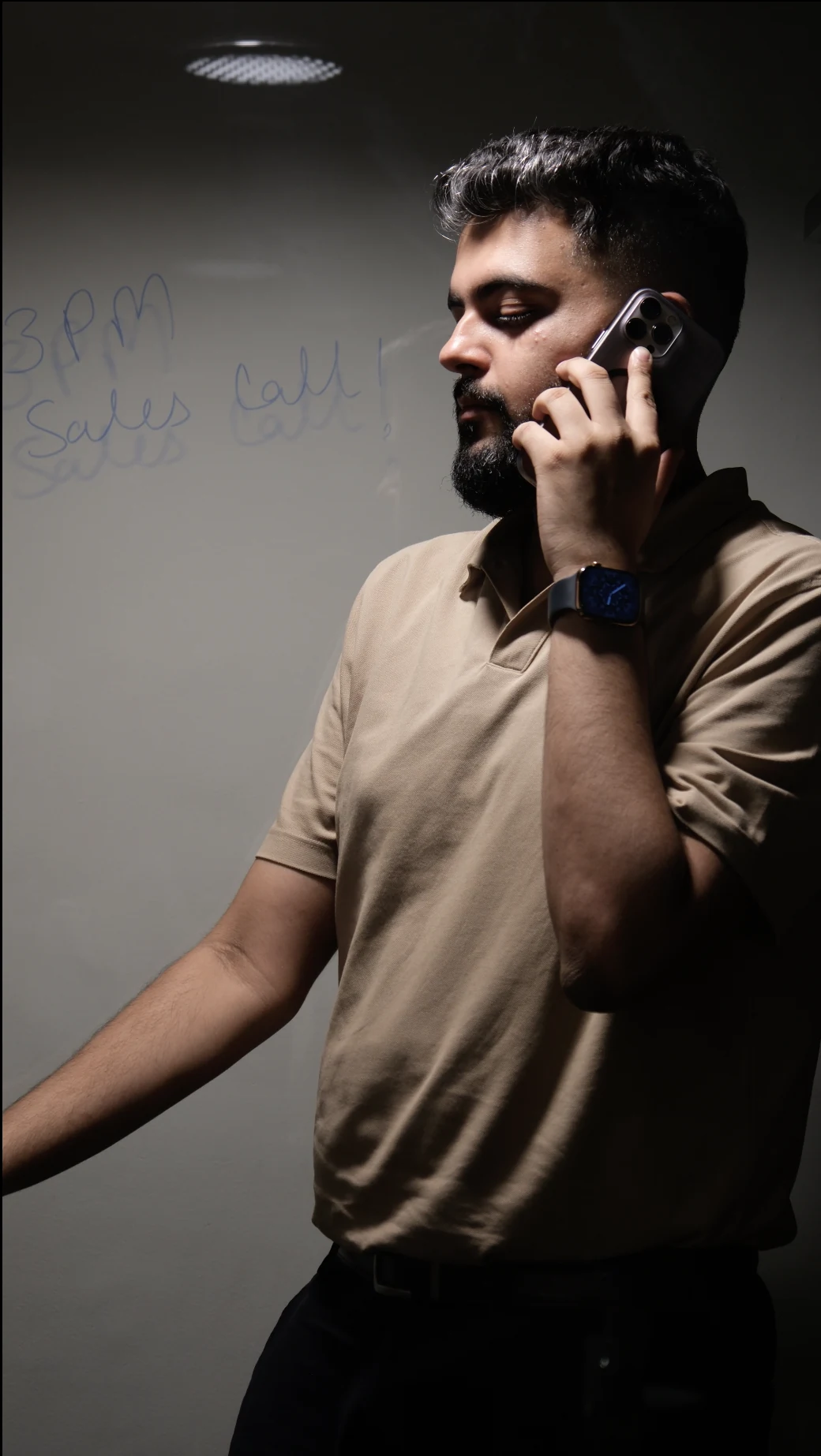 Close-up, on the phone at the whiteboard